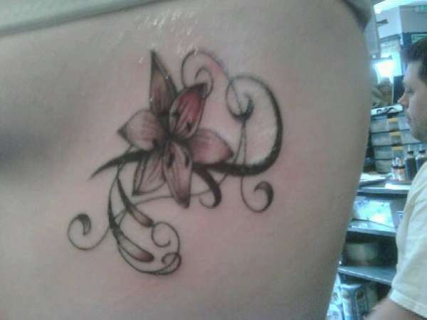 A Lily on my rib tattoo