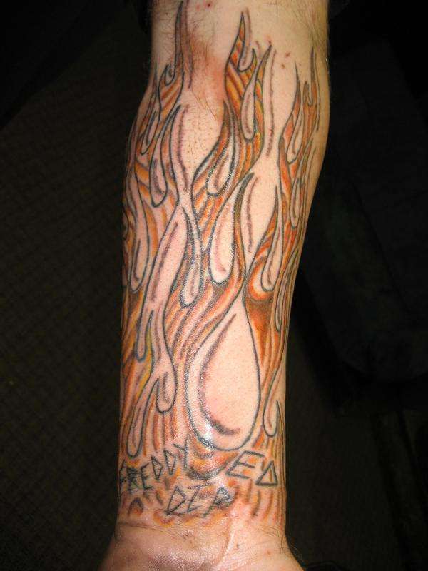 Wood grain flames tattoo