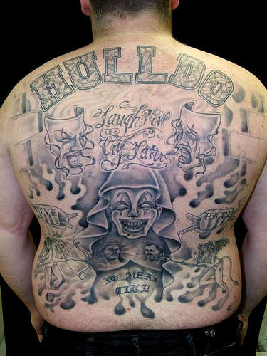 chicano style backpiece tattoo