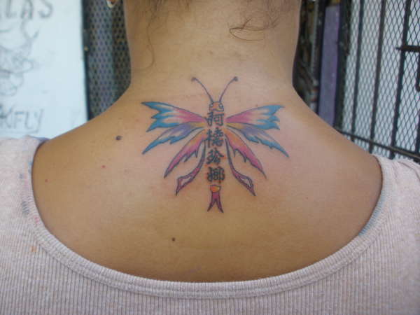 dragonfly in neck tattoo