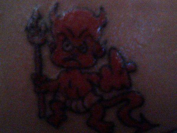 i tattooed this lil devil on my fionce's lower back tattoo