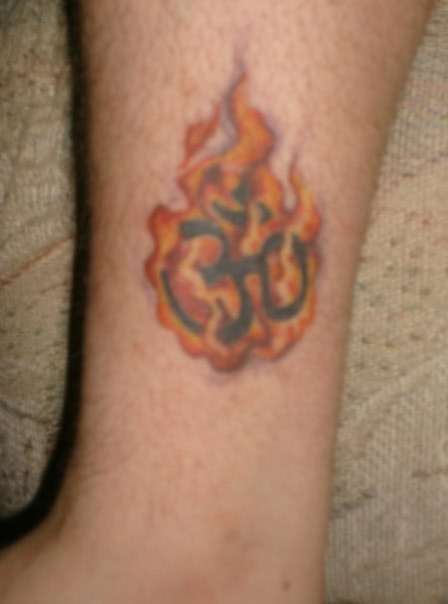 ohm with free hand flames tattoo