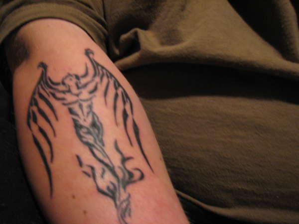 tribal demon tattoo