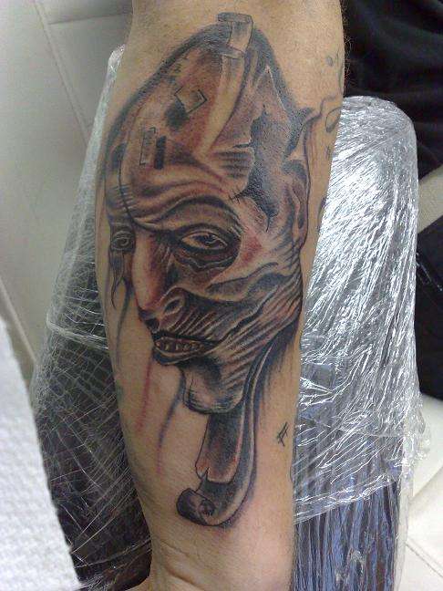 wierd face tattoo