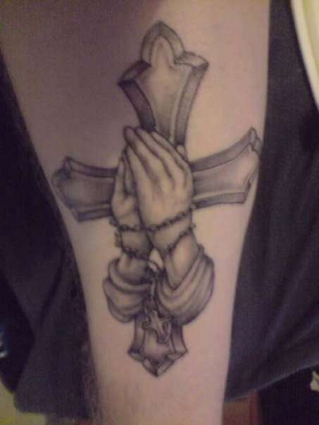 First tattoo cross and hands tattoo