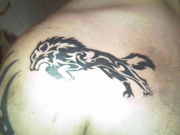 Leaping Wolf tattoo