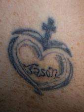 Tribal heart and cross with the name Jason. tattoo