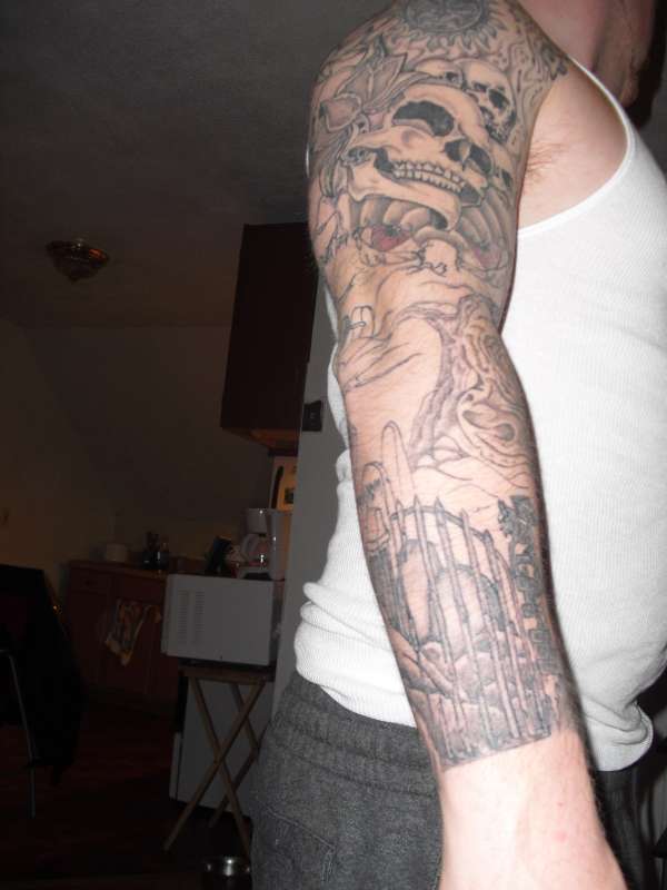 evil arm tattoo