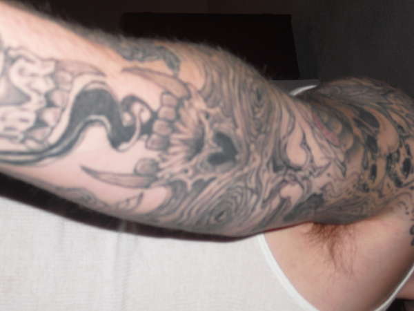 evil arm tattoo