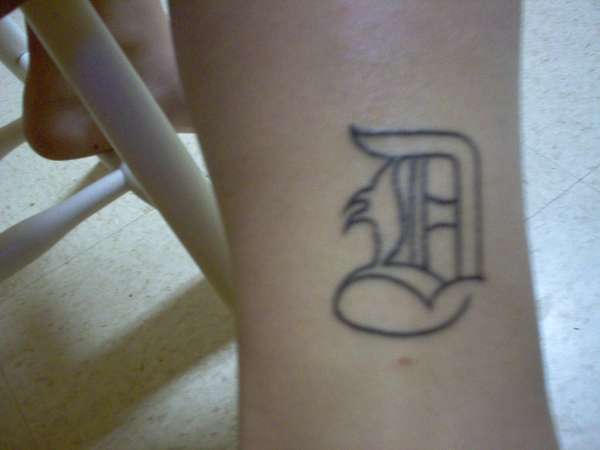 "D" tattoo