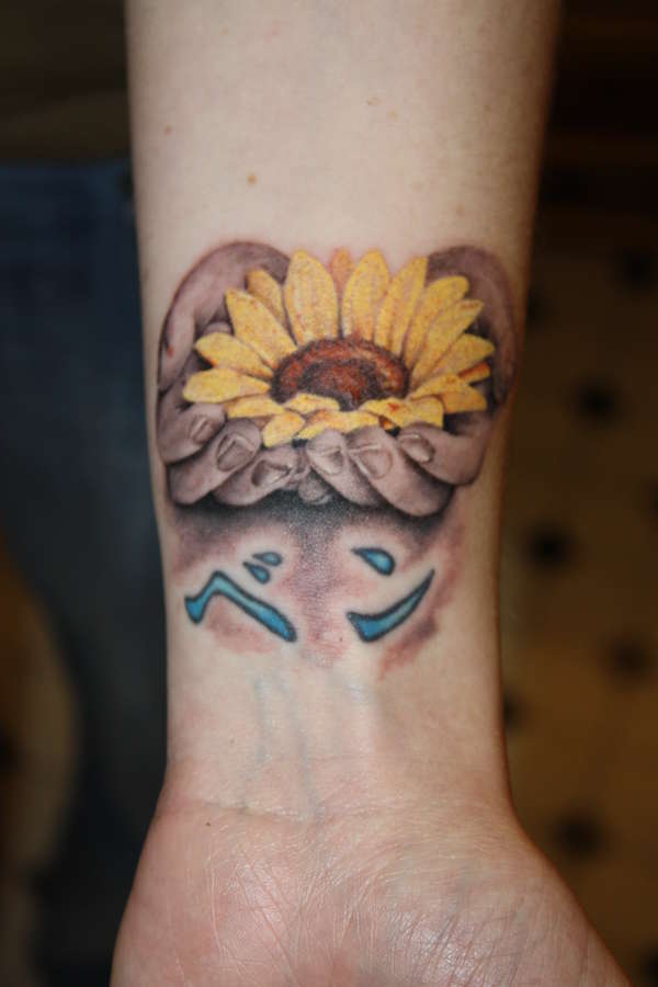 sunflower n hands tattoo