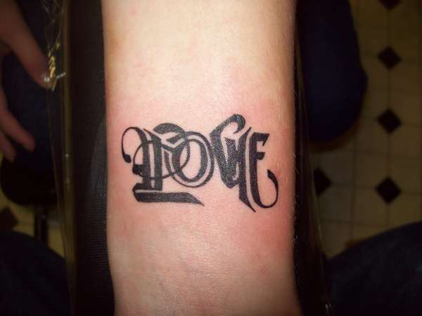Love....upside down it says hate tattoo