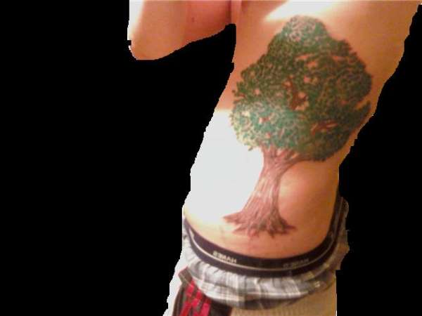 Tree on right side ribs tattoo