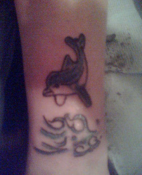 dolphin cover up tattoo