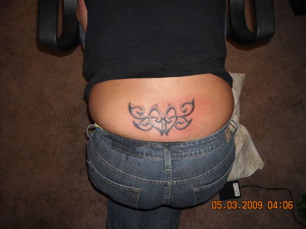 lower back piece tattoo