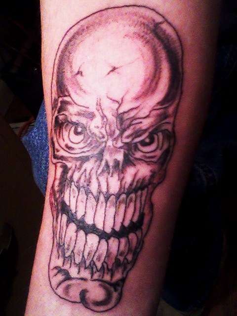 mean skull tattoo