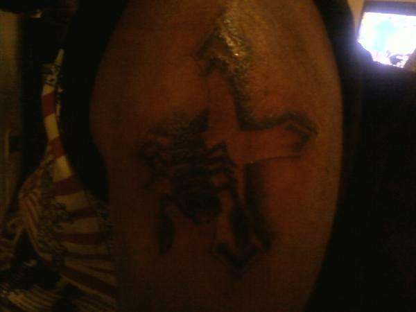 scorpion on a cross tattoo