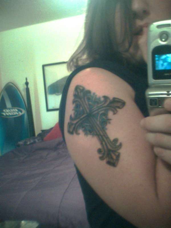 Cross made of stone tattoo