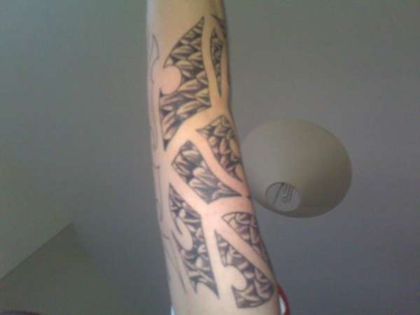 Half Finished Maori Scale Sleeve tattoo