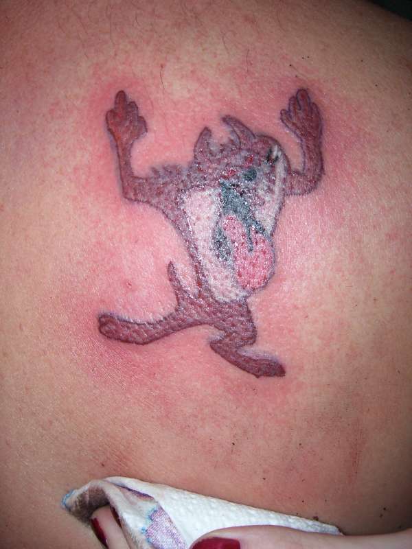 Taz Flips you off tattoo