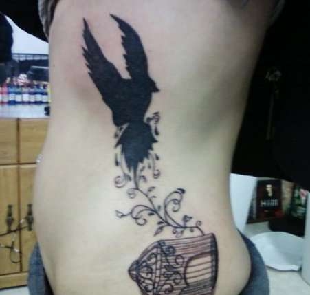 a caged bird does not sing tattoo