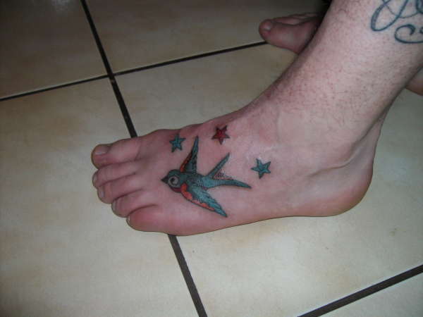bird tattoo on feet tattoo