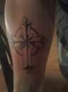 cross on forearm tattoo