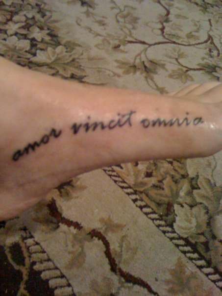 love conquers all tattoo