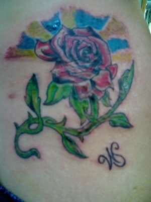 rose on hip tattoo