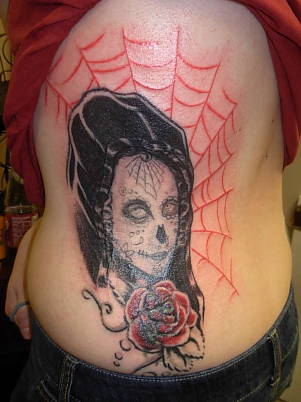 Creepy woman with rose tattoo