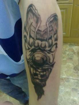 Dark clown face evil tattoo