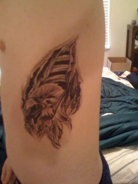 Eagle skin rip tattoo