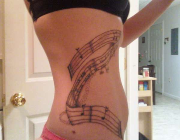 Music scroll tattoo