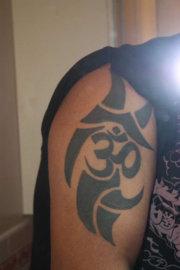 tribal around om symbol tattoo