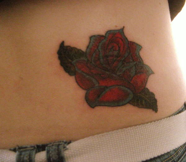 Rose cover up tattoo