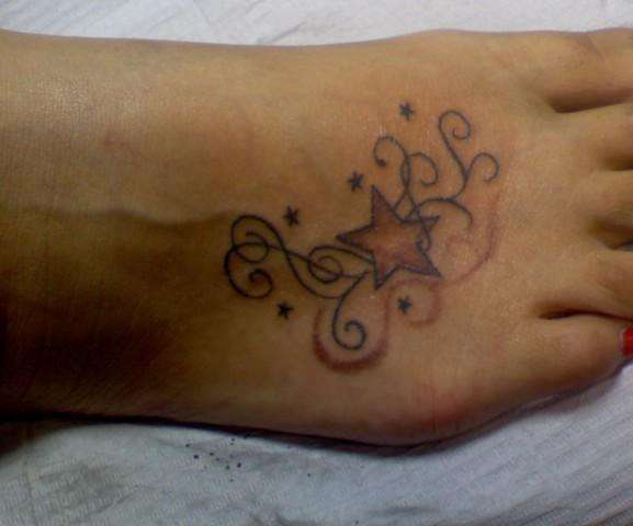 Swirls & Stars tattoo
