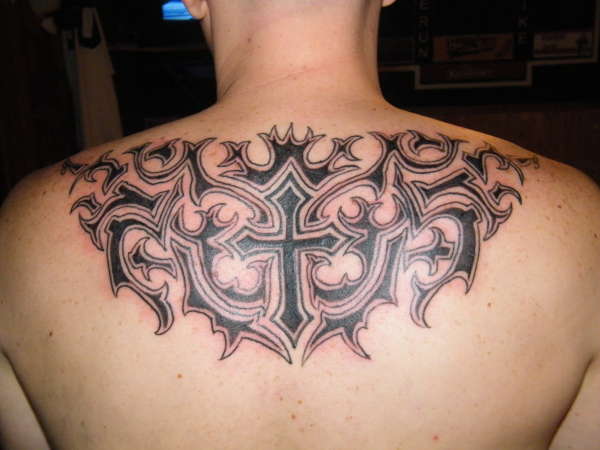 tribal cross tattoo on chest