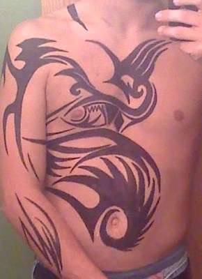 Tribal Chest and Arm tattoo