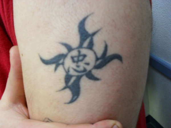 Tribal sun with Chineese Character tattoo