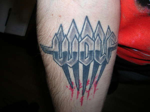 Wolf band logo tattoo
