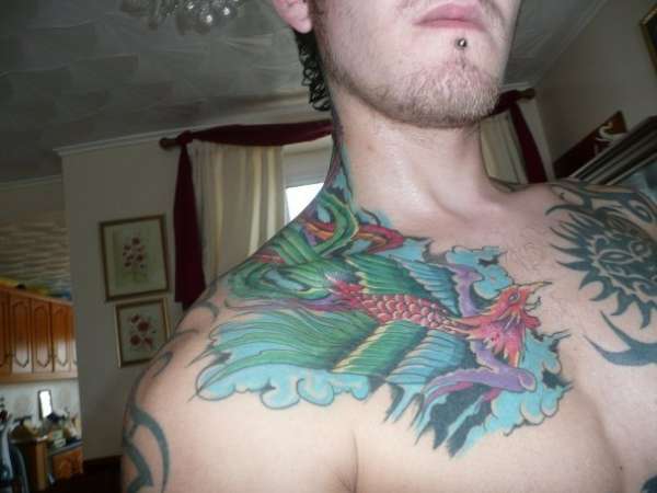 chest phonix tattoo
