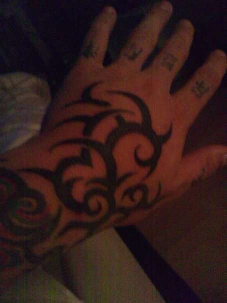 tribal on hand tattoo