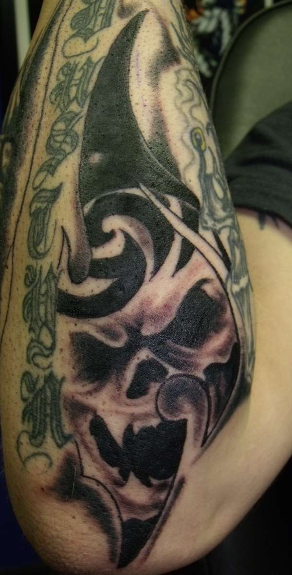 tribal with skull tattoo
