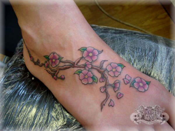 Cherry blossoms on foot tattoo