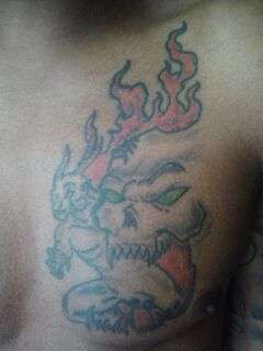 Flaming Capricorn tattoo