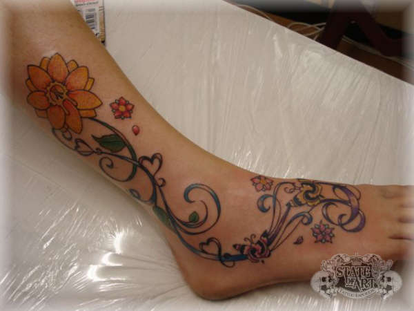 Flowers on foot tattoo