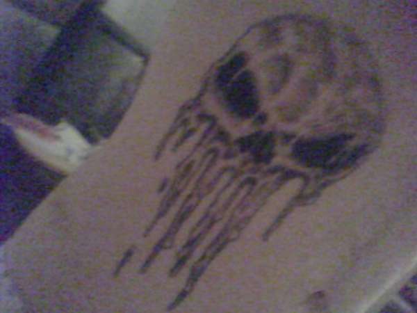 Spray painted Punisher skull tattoo