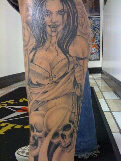 Vampire w skulls and roses tattoo