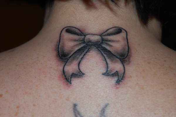 bow(back of neck) tattoo