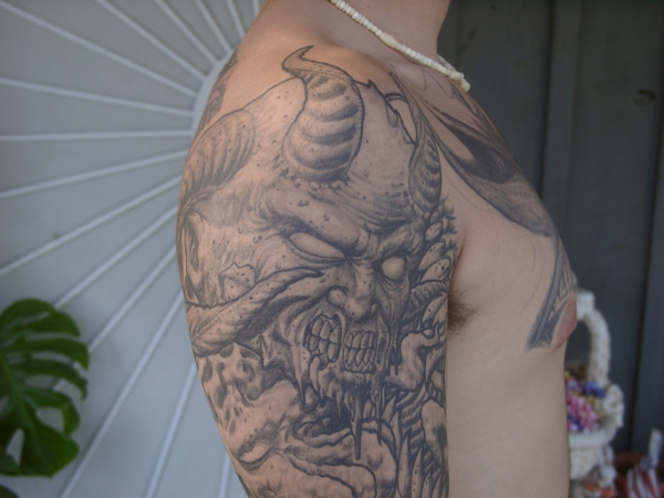 Top arm tattoo